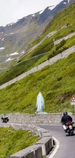 Motorcyclists on a scenic mountain road with lush greenery.