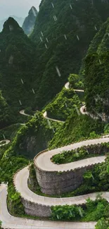 Winding mountain road with lush green scenery.