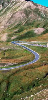 Scenic mountain road through green hills.