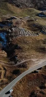 Stunning aerial view of winding mountain road.