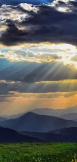 Majestic mountains under a sunset sky with dramatic clouds and sun rays.