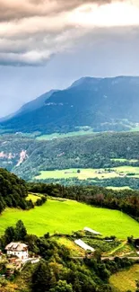 Stunning green valley with mountains under a cloudy sky wallpaper.