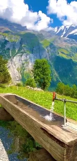 Tranquil mountain view with lush green landscape, cliffs, and a flowing water feature.