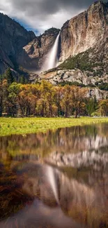 Scenic mountain waterfall with clear reflections in a serene landscape.