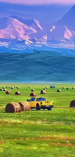Yellow truck in vibrant mountain scenery with hay bales.