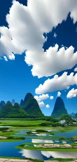 Beautiful view of green mountains under a vivid blue sky with fluffy clouds.