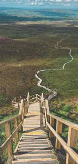 Scenic boardwalk path through lush green landscape.