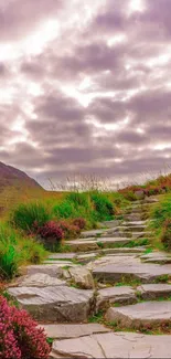 Stone pathway through green hills and lavender sky.