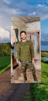 Smiling man in green camo with scenic landscape wallpaper.