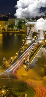 Illuminated historic bridge at night with flowing lights in a scenic cityscape.