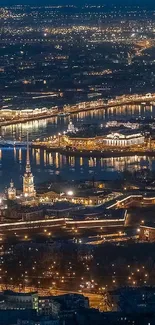 Aerial view of a cityscape with glowing lights at night.