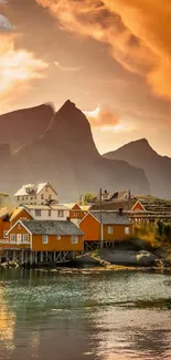 Nordic village with mountains and orange sky.