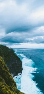 Dramatic cliff and ocean with expansive sky wallpaper.