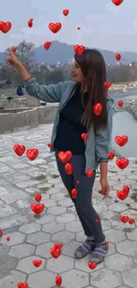 Young woman enjoying a scenic outdoor view by the river.