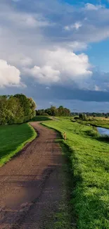 Scenic pathway through lush green landscape under a vibrant blue sky.