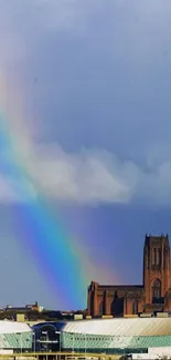 A vibrant rainbow arches over a cityscape with historical buildings and a seagull flying.