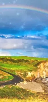 A rainbow arches over green cliffs and ocean waves on a scenic coastline.