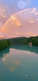 Rainbow over serene river with lush greenery and sunset.