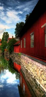 Serene red house reflection with dramatic sky.