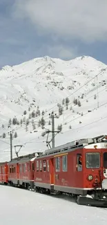 Red train in snowy mountains with scenic view.