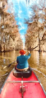 Person canoeing on a scenic autumn river.