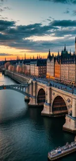 Stunning view of a cityscape with river and bridge at sunset.