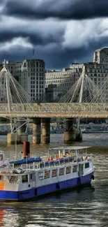 Vibrant cityscape with river and bridge under cloudy sky.