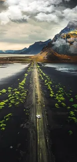 Scenic road through mountainous landscape wallpaper.