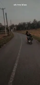 Motorcycle on a scenic road at dusk, with palm trees lining the path.