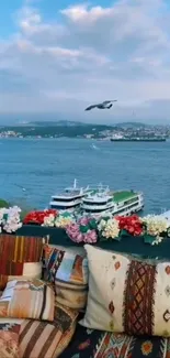 Scenic seaside balcony with ocean view and vibrant flowers.