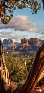 Sedona red rock formations with trees and blue sky.