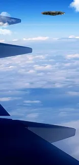 Airplane wing view with UFO in sky.