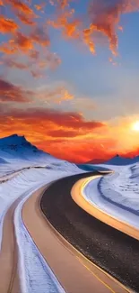 Snowy mountain road at sunset with vivid orange sky.