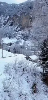 Yellow train travels through snowy mountain landscape.