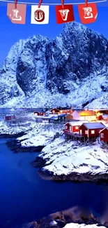 Snowy village with red cabins and blue water under a majestic mountain backdrop.