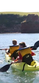 Scenic view of South West England with kayakers on the water.