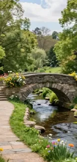Stone bridge over a stream in a colorful garden.