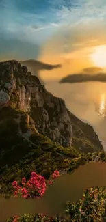 Stunning wallpaper of a sunset over a cliff with vibrant flowers in foreground.