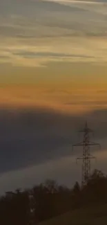 Scenic sunset cloudscape with powerline silhouette and orange hues.