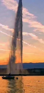 Scenic sunset with fountain and water reflection.