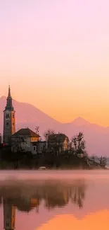 Serene sunset view over lake with church silhouette.