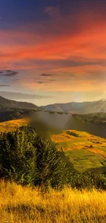 Scenic sunset landscape with green valley under glowing orange sky.