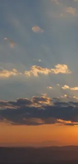 Breathtaking sunset sky with orange hues and clouds.