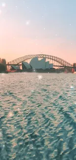 Serene Sydney Harbor sunset with bridge and opera house.