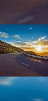 Scenic road under a vibrant sunset sky, perfect for mobile wallpaper.