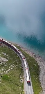 Scenic train journey beside a clear blue lake