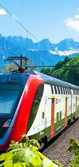 Scenic view of a vibrant train against mountains and lush forests.