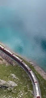 A scenic train journey beside turquoise waters and green landscapes.