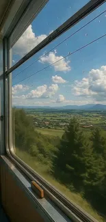 View from a train window showcasing lush landscape and blue skies.