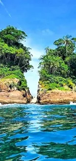 Tropical island view with blue ocean and lush greenery.